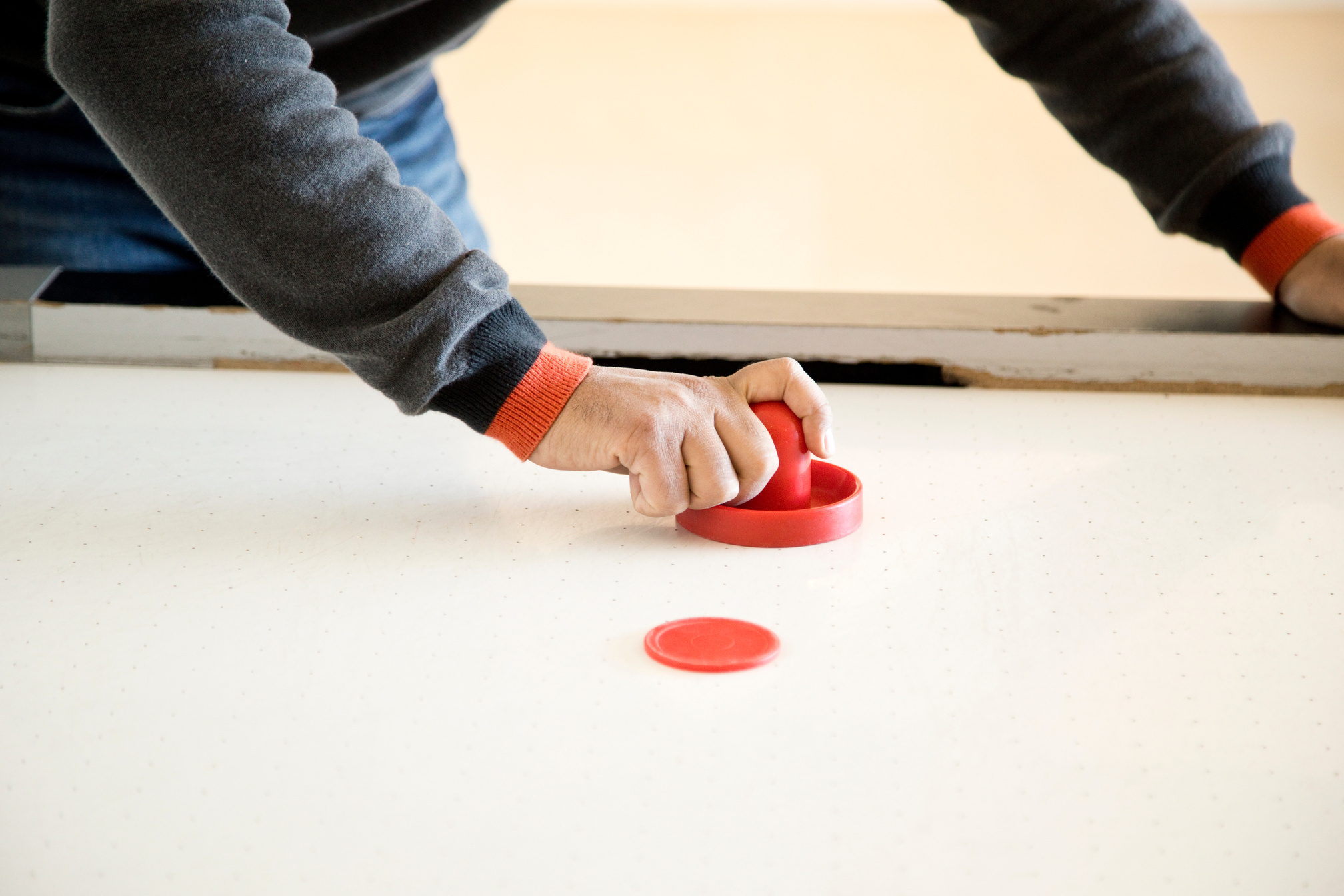 Man playing air hockey